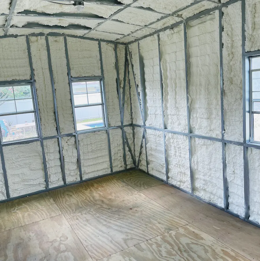 Closed-cell spray foam insulation applied to wall cavities in a residential project in Beebe